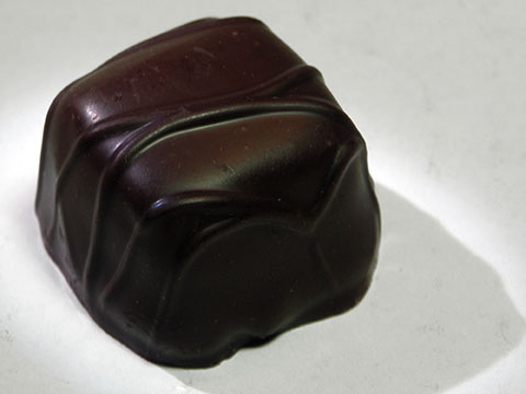 Photo of outside of See’s® Dark Chocolate Chip Truffle