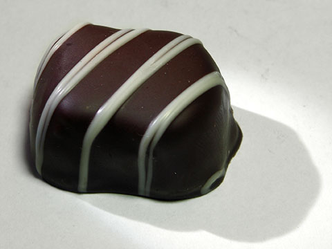 Photo of outside of See’s® Raspberry Truffle